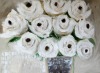 A Bunch of cream abc roses in a metal vast